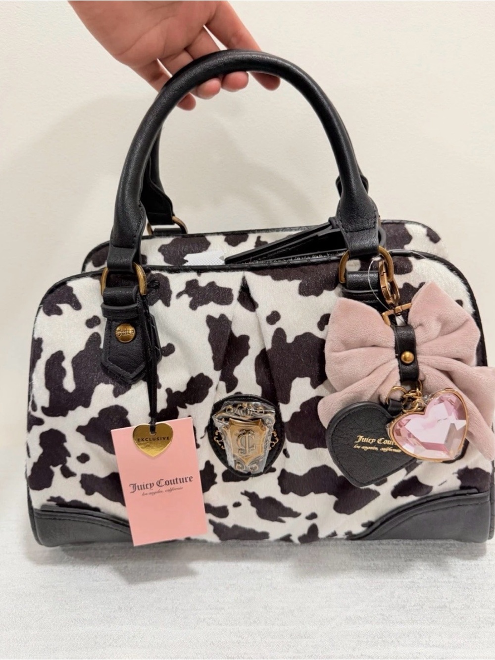 Juicy Couture Black & White Cow-Print Satchel with Pink Bow Charm